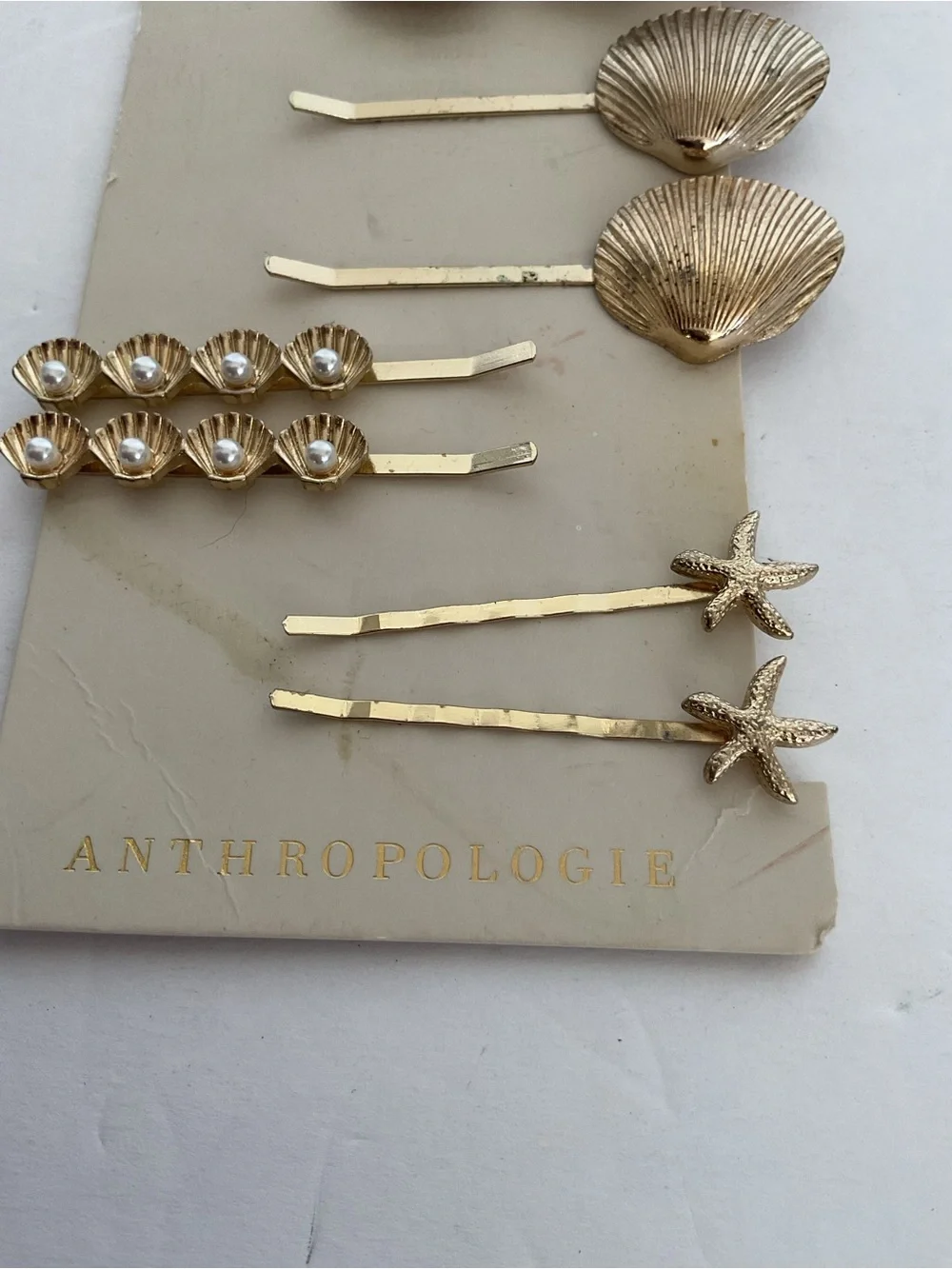 Anthropologie Gold she’ll hair clips NWT